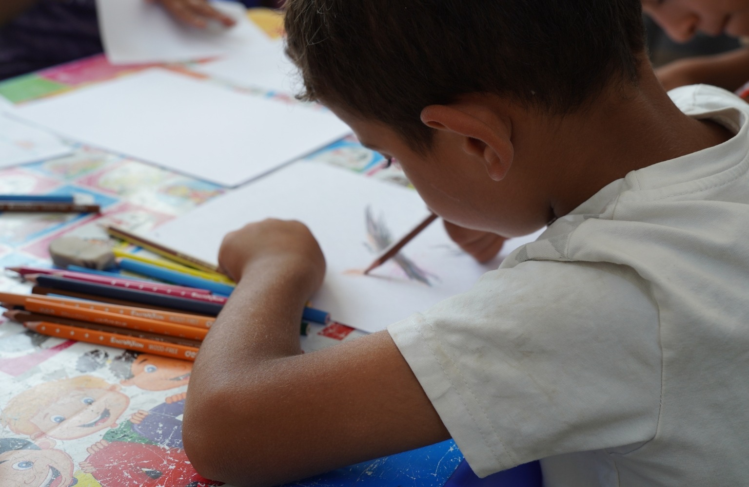 Child drawing at Al-Ubor Clinic, Mosul