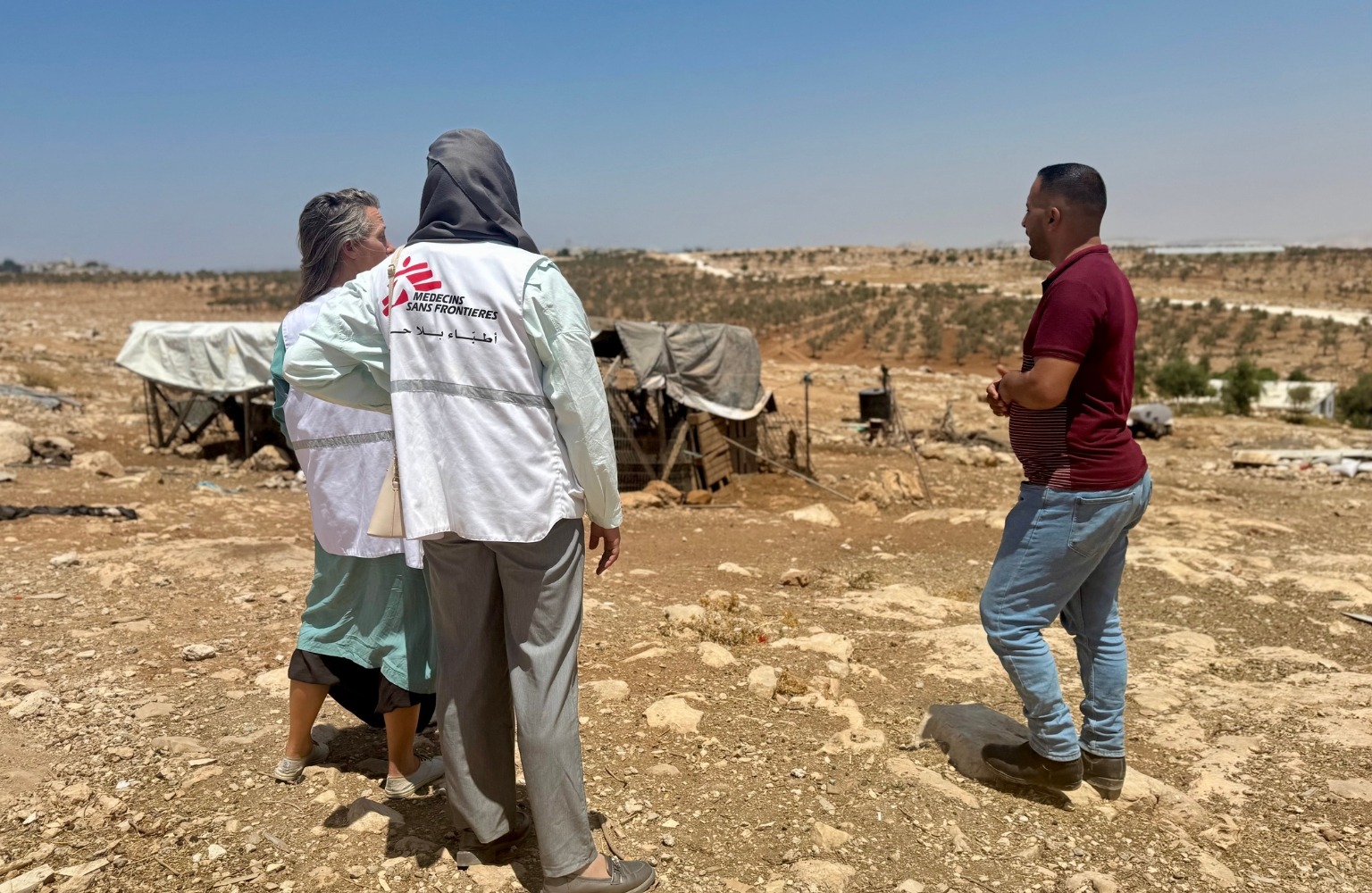 MSF Advocacy Manager and an MSF translator on a field visit to Kisan village, where recent settler violence forced 23 families to flee their homes.