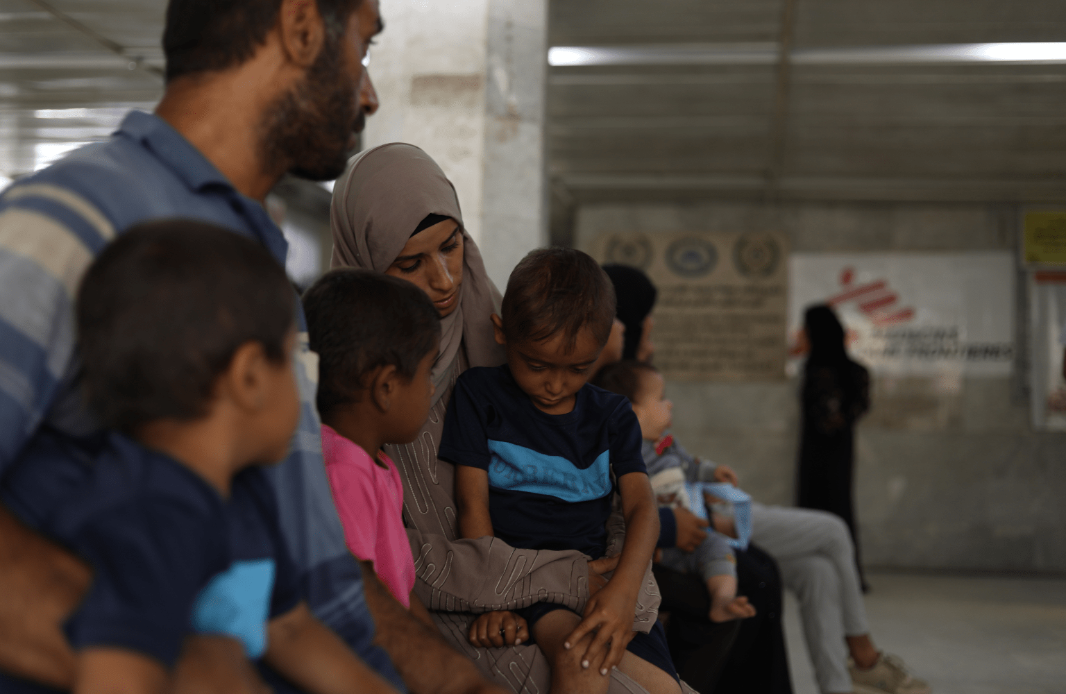 Hanan Zanoun cares for her three children, Qasem, 7, Abdallah, 5, and Mohammed, 3. They suffer from cystic fibrosis, celiac disease, and heart conditi