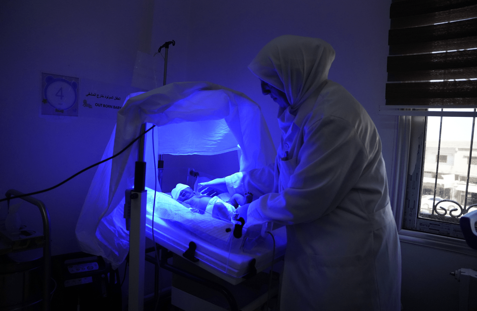 A Directorate of Health nurse cares for a newborn in the neonatal unit at Nawa National Hospital, where MSF supports neonatal services. (2)