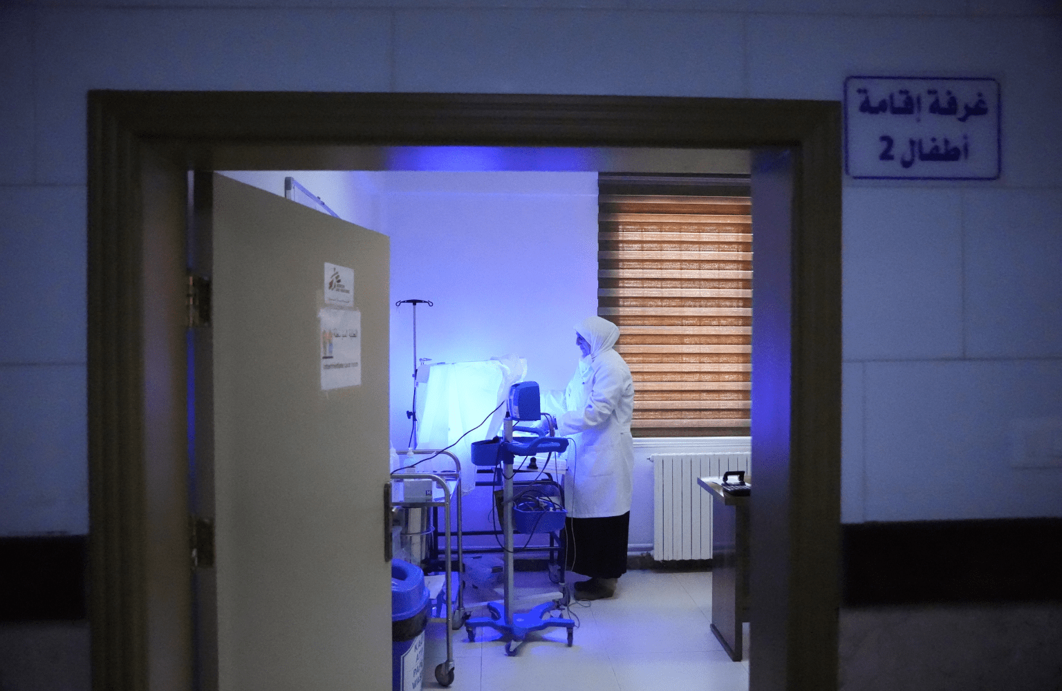 A Directorate of Health nurse cares for a newborn in the neonatal unit at Nawa National Hospital, where MSF supports neonatal services.