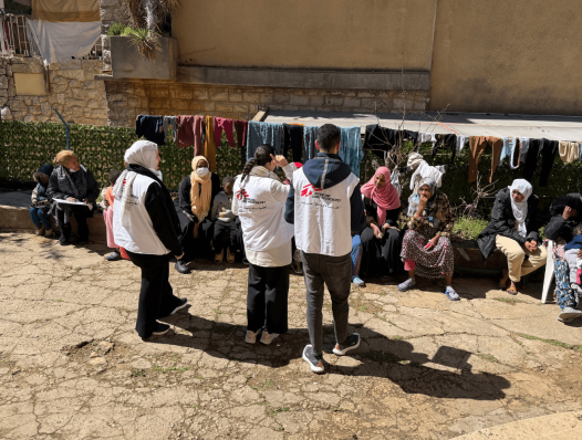 MSF mobile clinic teams talking to patients in Ghosta, Mount Lebanon